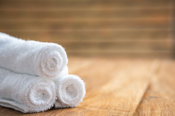 Rolled up white spa towels, selective focus, vintage
