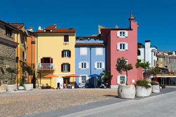 Colourful houses on a small square in the picturesque town of Piran in Slovenia