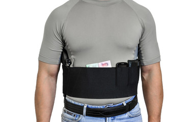 Torso of a man dressed in civilian clothes, underneath the shirt there is a set for concealed carry...