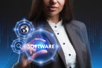 The concept of business, technology, the Internet and the network. A young entrepreneur working on a virtual screen of the future and sees the inscription: Software