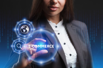 The concept of business, technology, the Internet and the network. A young entrepreneur working on a virtual screen of the future and sees the inscription: E-commerce