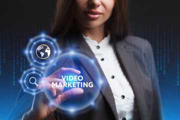 The concept of business, technology, the Internet and the network. A young entrepreneur working on a virtual screen of the future and sees the inscription: Video marketing