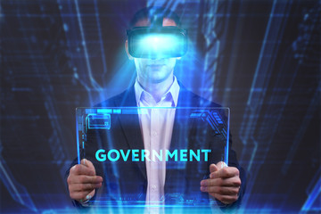 Business, Technology, Internet and network concept. Young businessman working in virtual reality glasses sees the inscription: Government