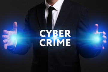 Business, Technology, Internet and network concept. Young businessman working on a virtual screen of the future and sees the inscription: Cyber crime