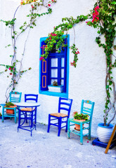 Fototapeta na wymiar Charming traditional street bars and tavernas of Greece. Kos island