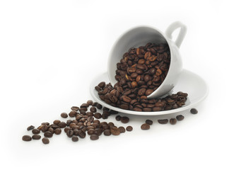 Cup of coffee full of coffee beans