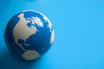 business world globe on blue ground