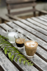 The ingredients of coffee on a wooden desk