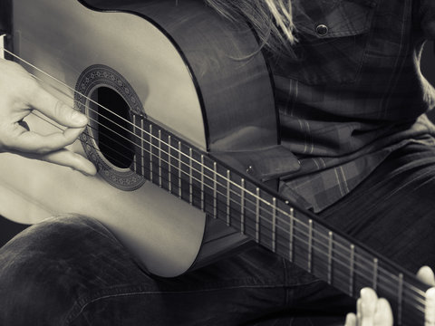 Male hands with guitar