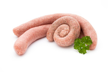 Raw sausages with herbs and spices.