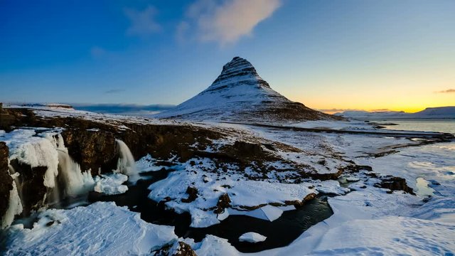 4K Time lapse of sunrise over kirkjufellsfoss waterfall and Kirkfufell mountain, Iceland