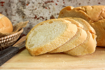 fresh bread slide on wooden cutting board