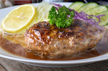 Japanese style hamberger or hamberg serve with gravy sauce.