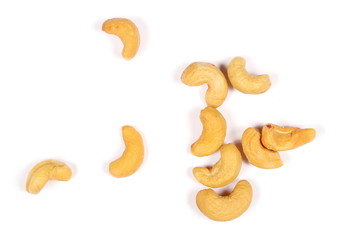 Unshelled roasted and salted cashew nuts isolated on white background, top view
