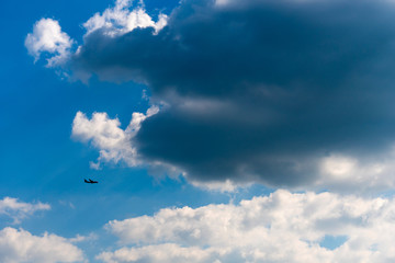 Small silhouette of an airplane flying