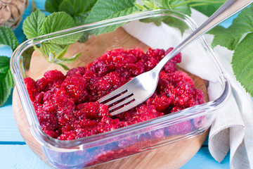 Fresh raspberry with a fork