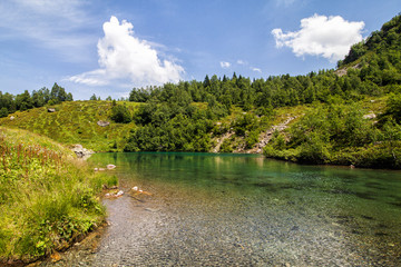 Fototapeta na wymiar Alpine lake among the rocks