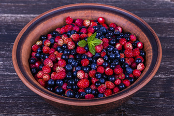 Fresh strawberries and blueberries , wild berry.