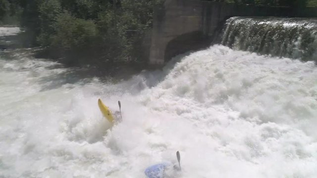 Aerial of 2 Extreme Kayakers Kayaking Over Dam Waterfall White Water Cliff Edge in 4K 60P