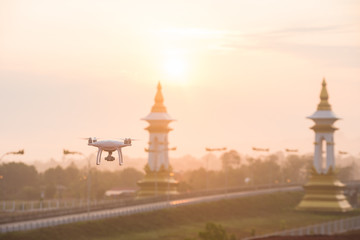 Flying drone and remote control natural background