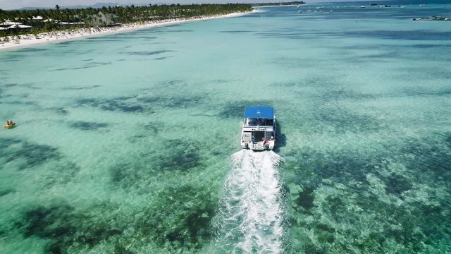 Speed boat or yacht sailing in the caribbean sea near Punta Cana beach