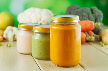 Three jars with vegetable and fruit puree