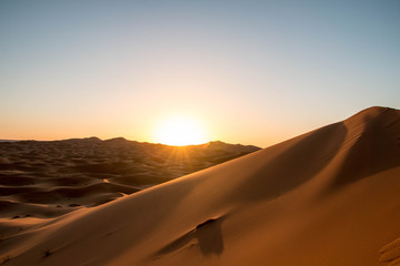 Fototapeta na wymiar Sunrise in the Sahara Desert at Erg Chebbi, Morocco