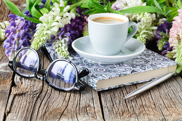 cup of coffee and notebook on table