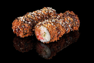 Sushi rolls on black background