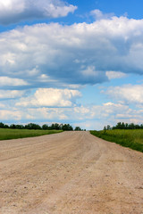 Beautiful clouds over a country road