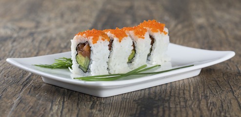 Delicious mixed sushi arranged on white marble surface