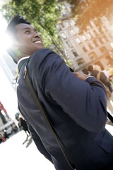 Fototapeta na wymiar Businessman walking in the streets of Manhattan