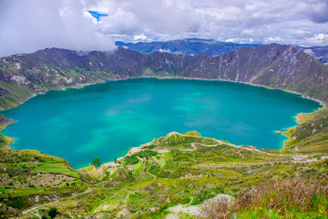 Amazing view of lake of the Quilotoa caldera. Quilotoa is the western volcano in Andes range and is...