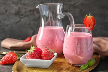 Fresh yogurt smoothie with strawberry on grunge background