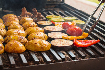 vegetables roast on a large grill