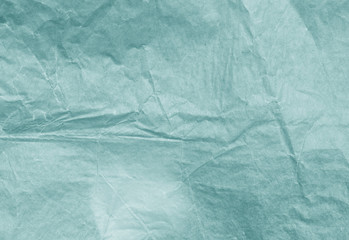 cyan color paper surface.