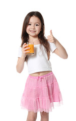 Cute little girl with glass of juice on white background