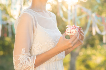 bride holding ring box