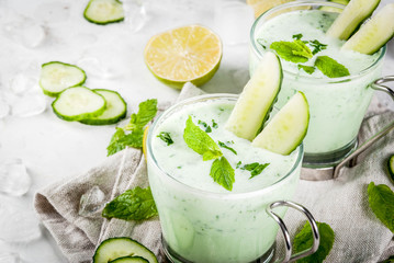 Summer food. Refreshing dishes. Cold soup of cucumber, avocado, with herbs and mint. With serving...