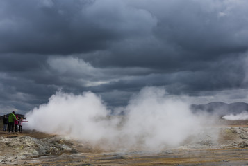 People at steam pits of Geothermal Landscape Hverarond on Iceland