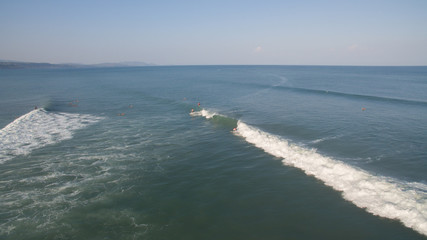 Aerial view of a surfer on a wave in Jaco, Costa Rica