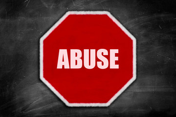 abuse written on  a stop sign