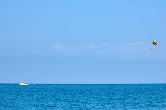 Parasailing at sunny day on the sea