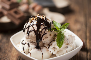 Fresh Chocolate ice cream on a plate close up