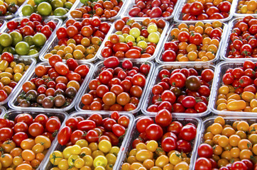 Close up of fresh grape tomatoes at the farmers' market.