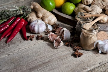 Cup of ginger tea with honey and lemon on a wooden table