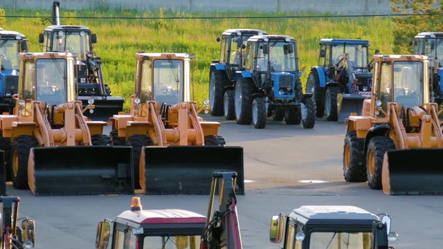 new construction equipment, bulldozers and tractors in the Parking lot