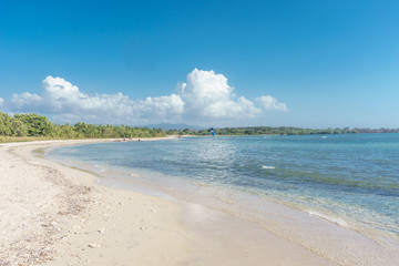 Cuba - Caribbean beach Playa Rancho Luna in Cienfuegos. Sandy coast