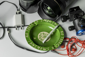 Wide-angle lens with earphone charger and ashtray