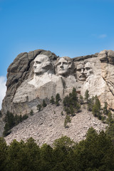 Vertical Side view of Mount Rushmore with sunlight
